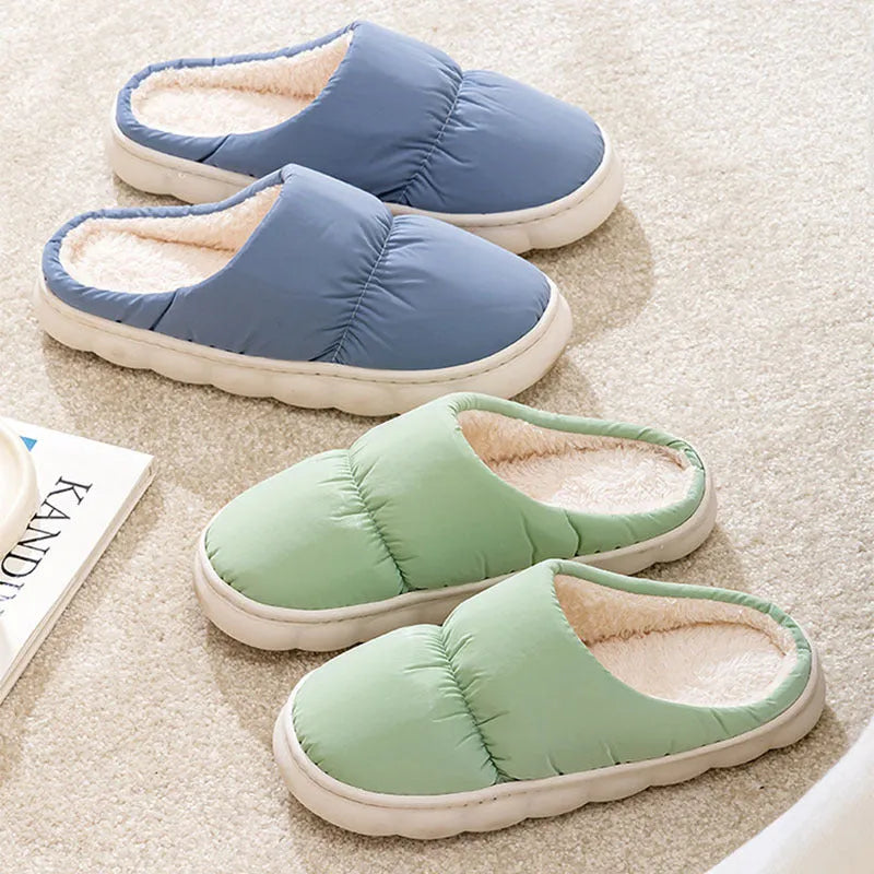 Blue thick-soled indoor slippers with artificial leather upper and plush lining on a rubber sole.