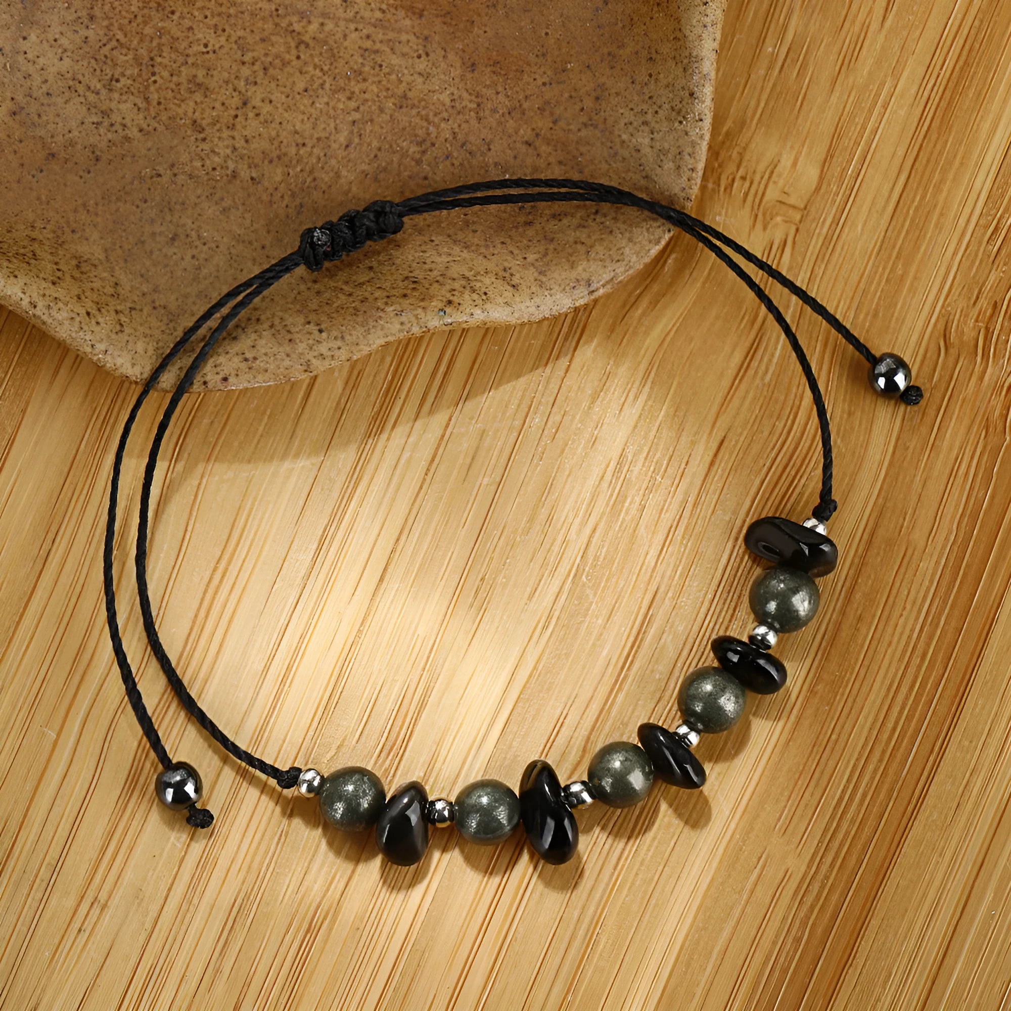 Black garnet stone beaded bracelet with geometric shapes and moon elements in original gravel design