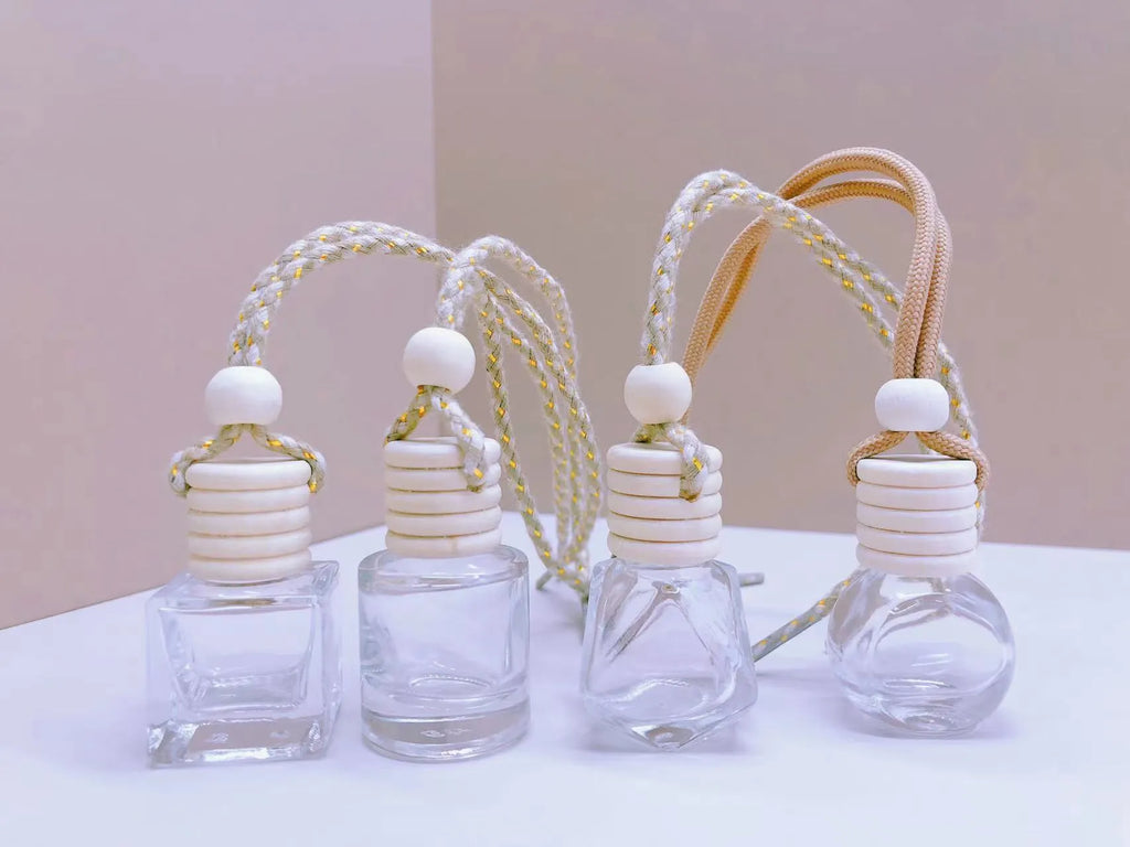 Car perfume pendant in glass bottle showing cylinder, diamond, flat drum and square style options