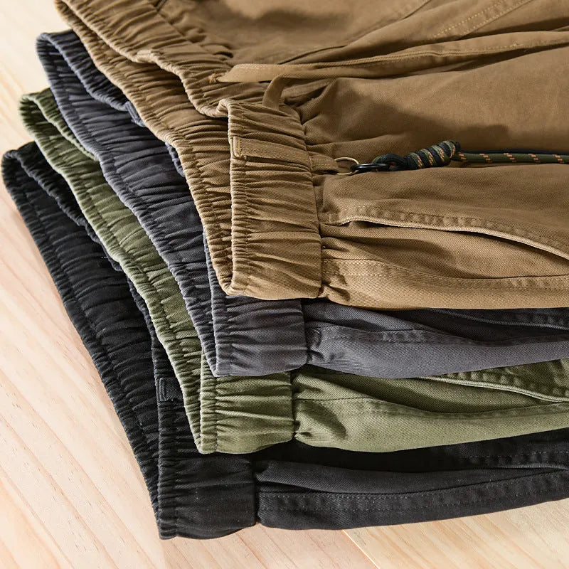 Men's Army Green cotton overalls with drawstring waist and banded ankles laid flat.