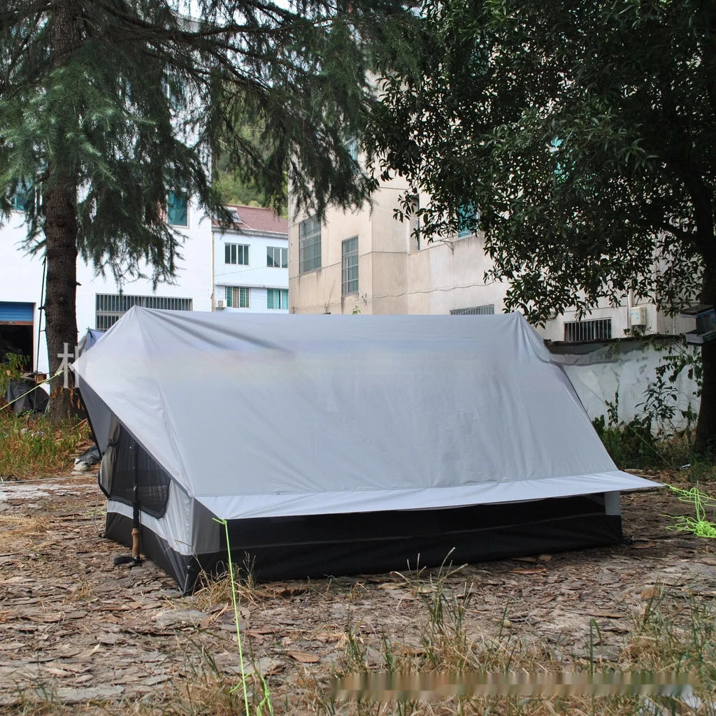 Brown or white A-line pole-free cabin tent for 2-3 people with hiking cane setup.