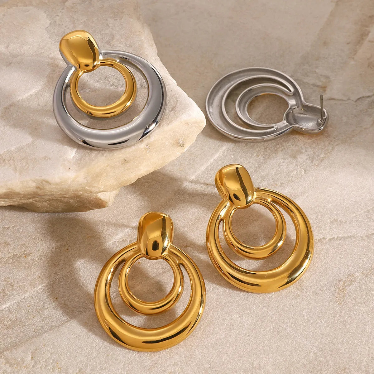 Round double layer hollow geometric stud earrings in gold tone with butterfly backs