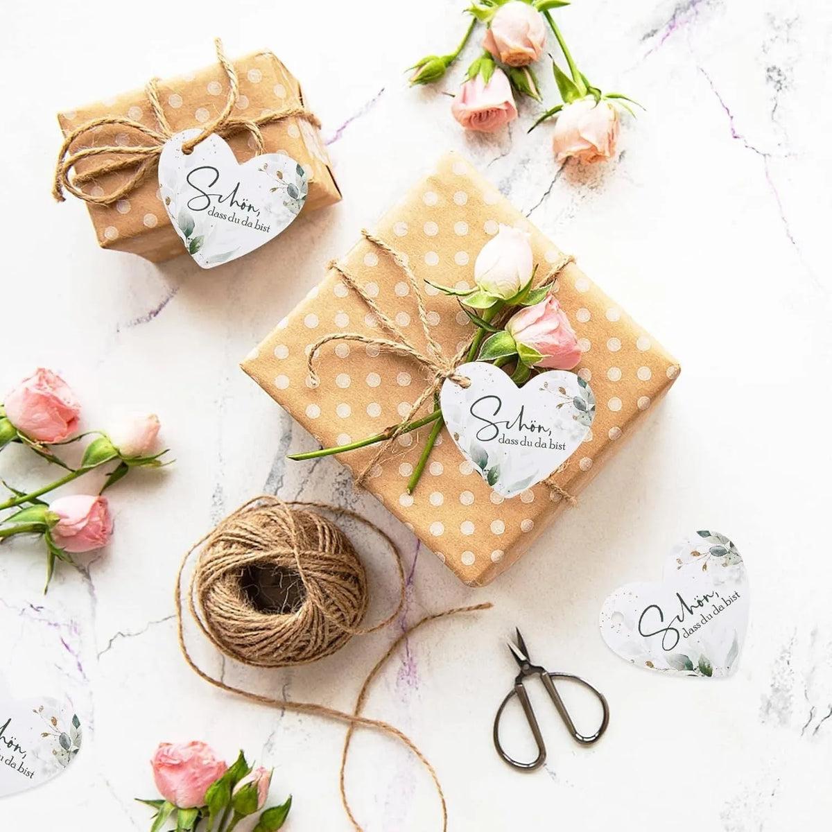 Pack of 50 floral heart-shaped paper gift tags in two colour styles for parties and weddings.