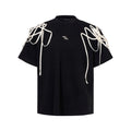Black loose fit T-shirt with rivet ribbon padded shoulders and short sleeves