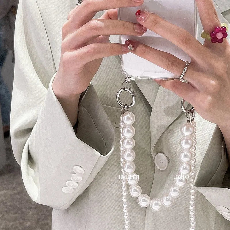 Soft iPhone case with large white pearl decoration and silver chain in Japanese Korean style.