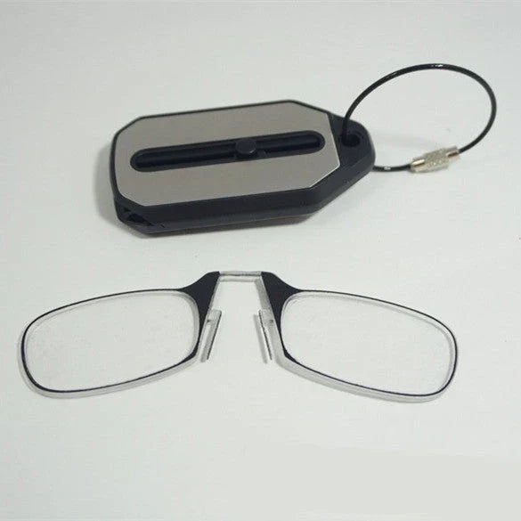 Compact magnetic reading glasses with rimless frames and adjustable nose clip