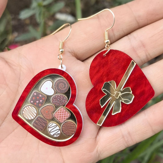 Romantic heart-shaped acrylic earrings with water pattern or sequin design, available in red and pink colors