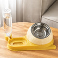 Brown elevated cat food bowl with automatic water dispenser bottle, whisker-friendly design