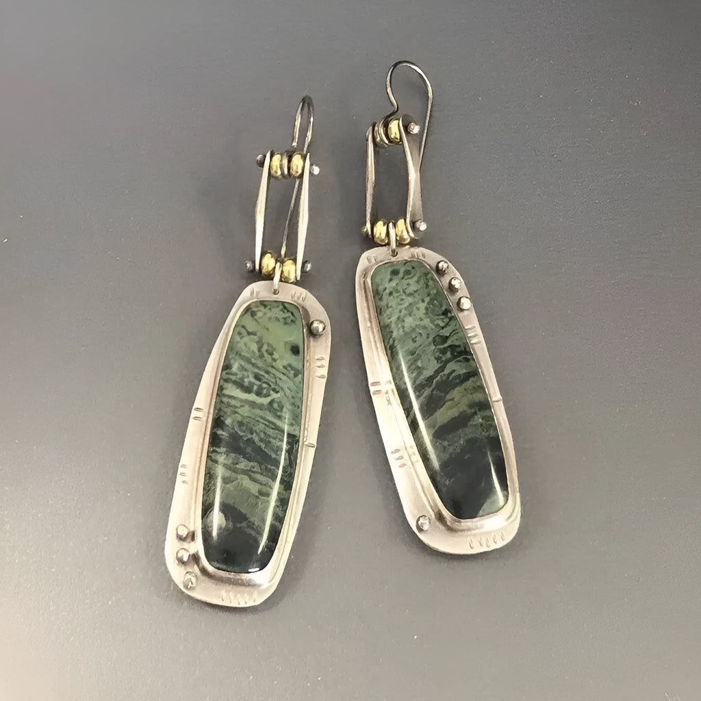 Geometric two-colour marble pattern alloy drop earrings showing marbled surface detail