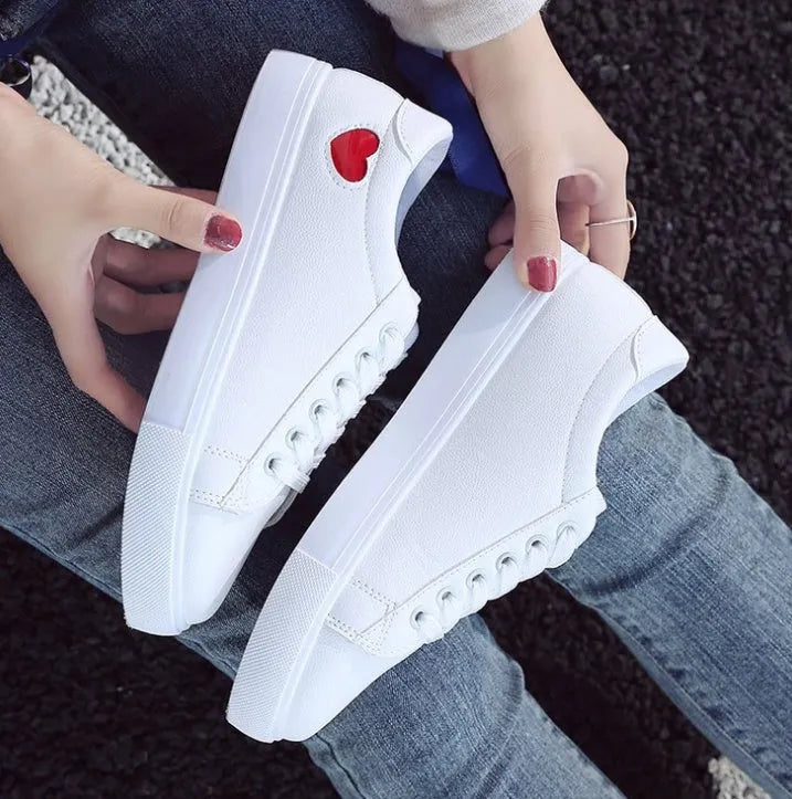 Women's PU leather heart flats shoes with colourful beads and stainless steel pendant on white background