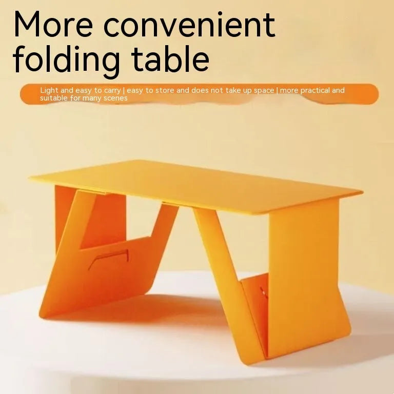 Foldable wooden laptop tablet stand in black, standard size, with legs open on a flat surface