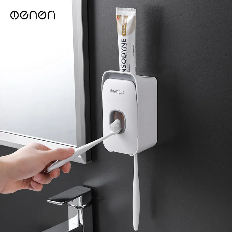 Automatic wall-mounted toothpaste dispenser in blue, grey, or pink ABS plastic with electric pump
