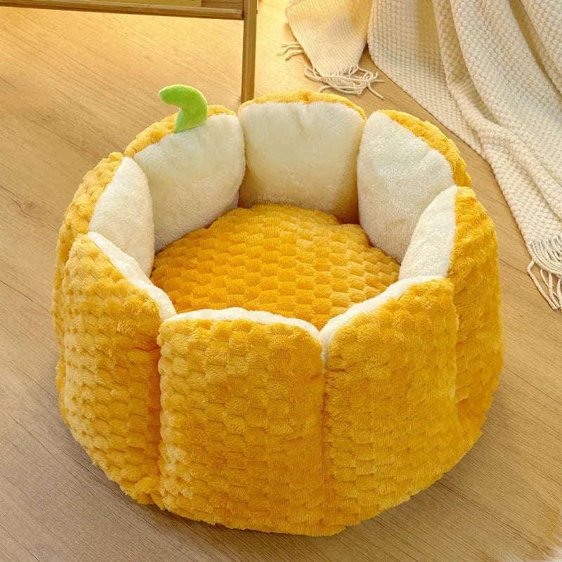 Pumpkin-shaped cat bed with raised rim showing interior cotton filling