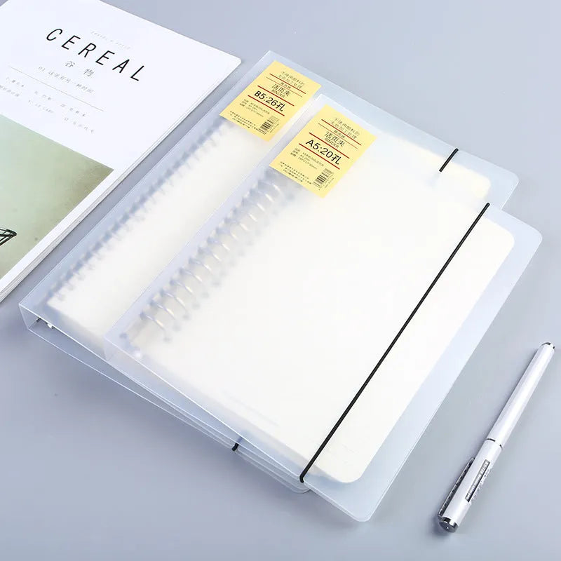 A5 loose-leaf notebook with 26-hole binder system showing horizontal line ruling on paper