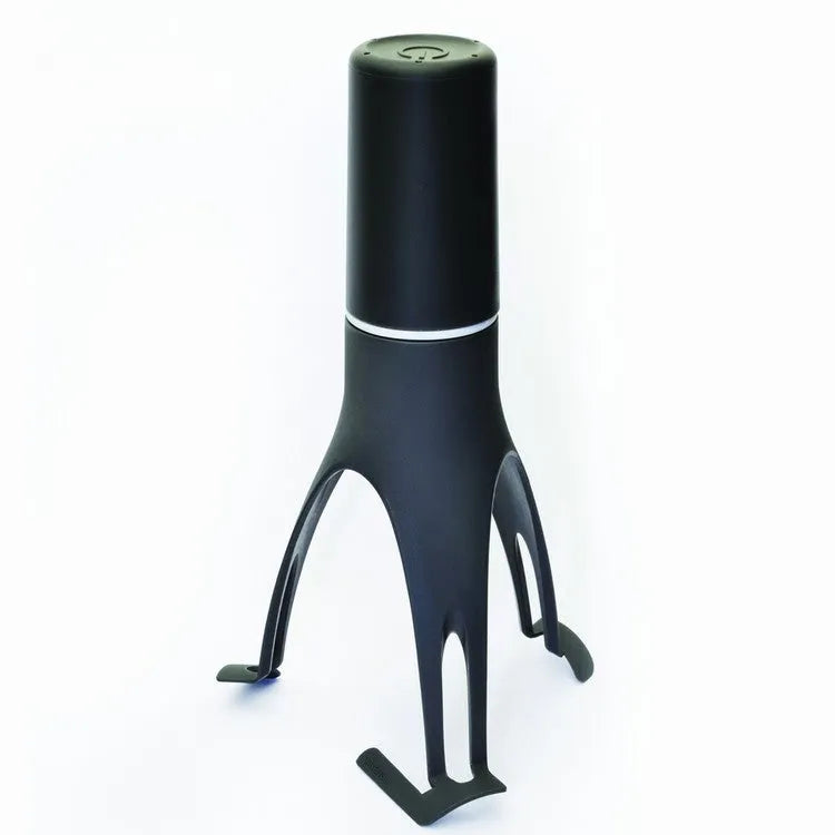 Green Uutensil Stirr automatic handheld mixer for pots, showing its compact size.