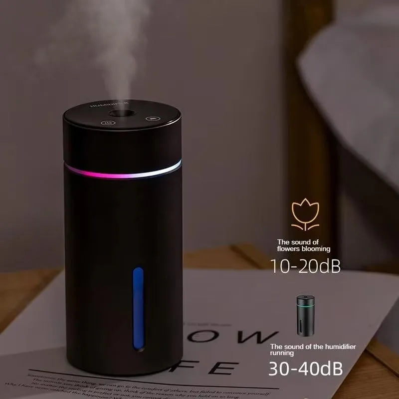 Compact aluminium car air humidifier and essential oil diffuser with night light on wooden desk