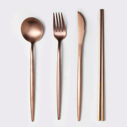 Premium stainless steel cutlery set with a mirror-polished finish, including coffee spoons, dessert spoons, main meal spoons, dessert forks, main forks, and chopsticks, presented in a stylish gift box.