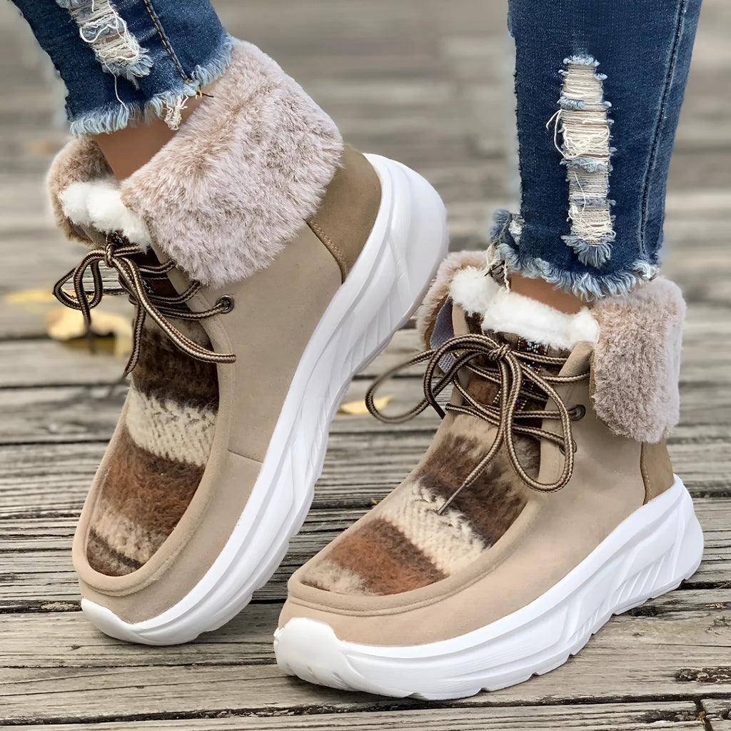 Women's beige lace-up snow boots with fuzzy lining and a thick rubber platform sole