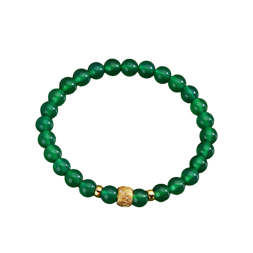 Green agate and sterling silver bracelet with geometric beads and yellow gold plating.