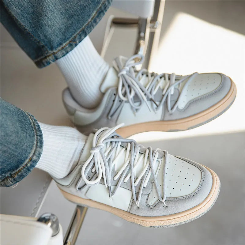 Men's low-top lace-up sneaker in beige with height increase, microfiber upper, and rubber sole on flat surface