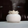 Lotus aromatherapy humidifier with ceramic polished container and PE lotus top, 100x85mm, 200ml capacity