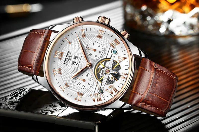 Men's automatic hollow tourbillon mechanical watch with 42mm dial and leather band on wrist