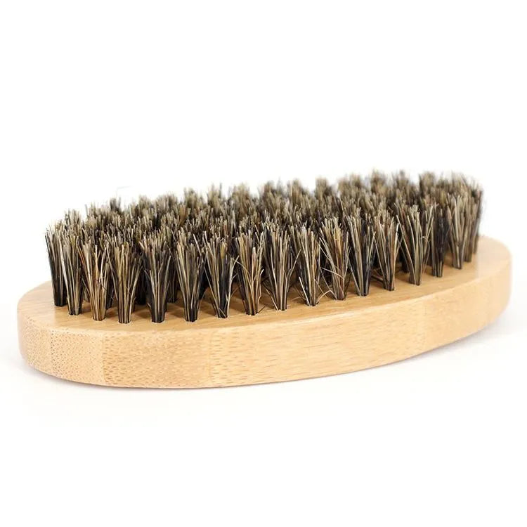 Beard Care Kit 6-piece set with beard cream, beard oil, peach wood comb, bristle brush, scissors, and linen bag on a wooden surface
