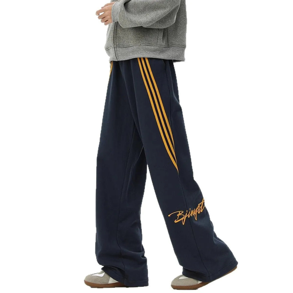 Men's striped loose straight-leg casual pants in black, white gray, or navy blue, sizes M to XXXL.