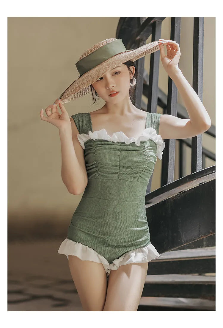 Korean style triangle top one-piece swimsuit for women with high waist in black colour.