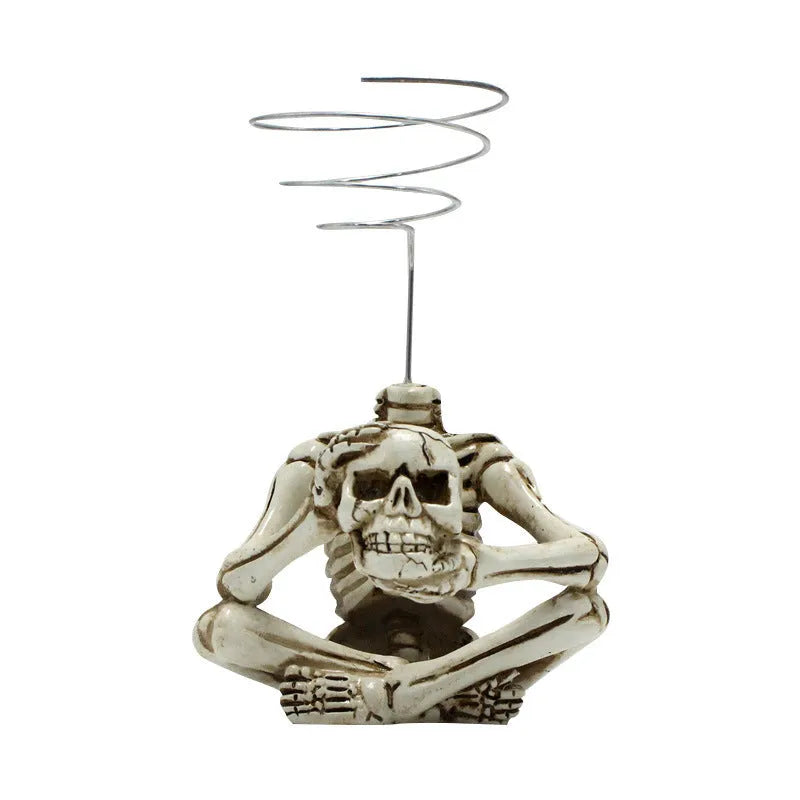 Gothic skull design resin potted bracket for tillandsia air plant, showing iron base and overall dimensions.