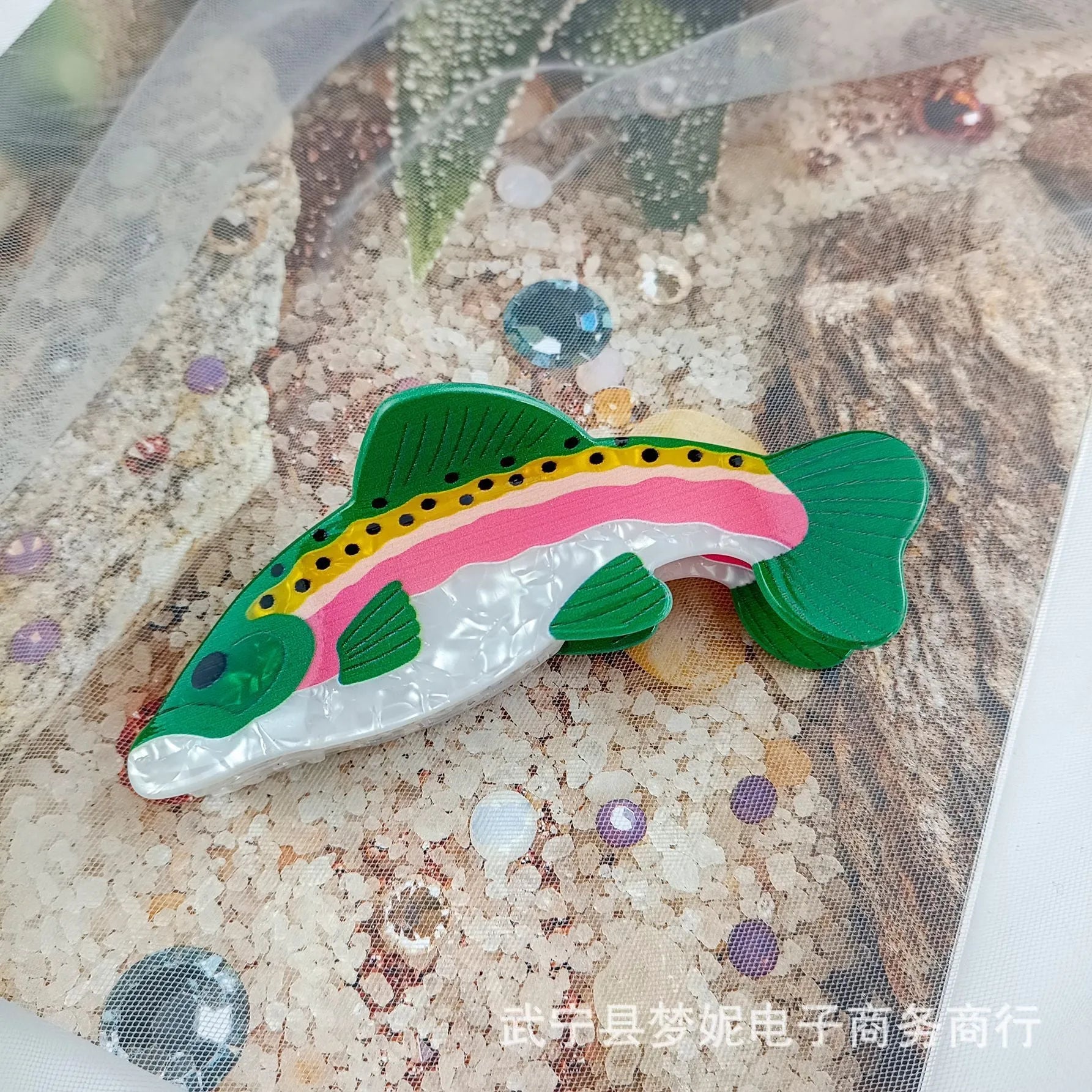 Dark green PVC hair clip with a printed design of a rainbow trout and a carp.