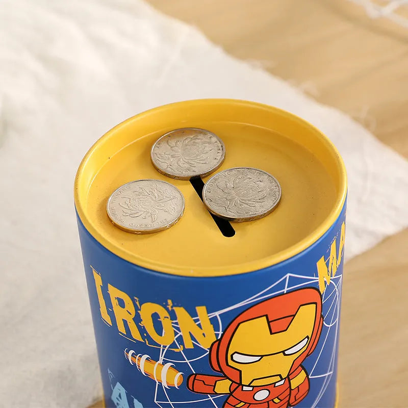 British style creative metal piggy bank on a wooden desk, showing coin slot.