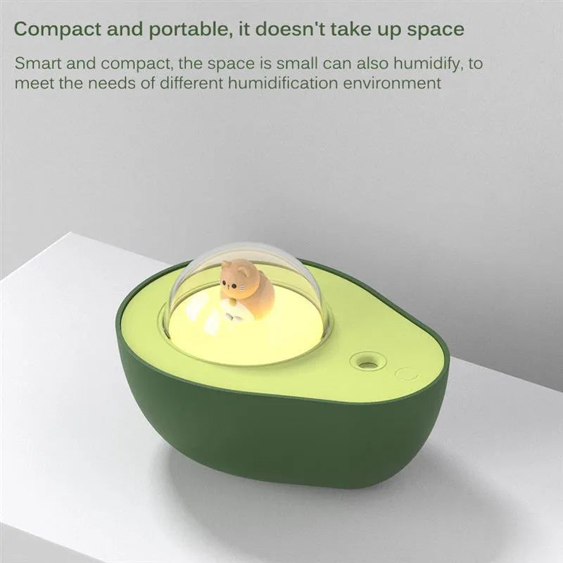 Green avocado-shaped mini USB humidifier with night light on a desk