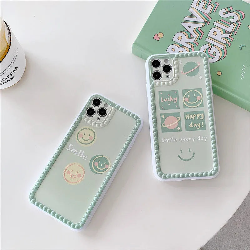 Green soft TPU iPhone case with geometric smiley face and polka dot frame design.