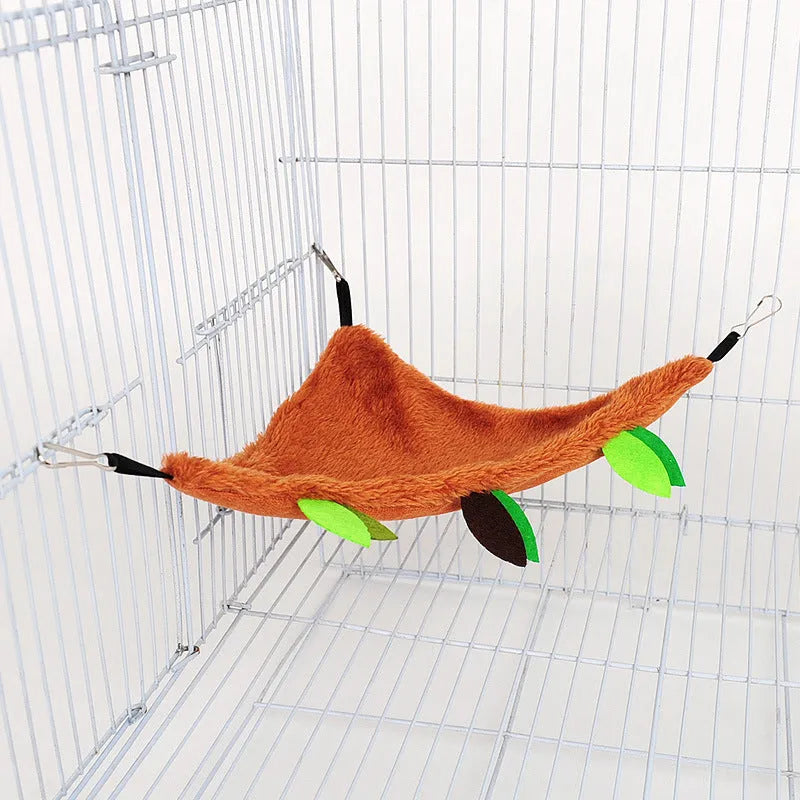 Plush toy hamster tree with round swing and triangle hammock attached to cage via metal buckle