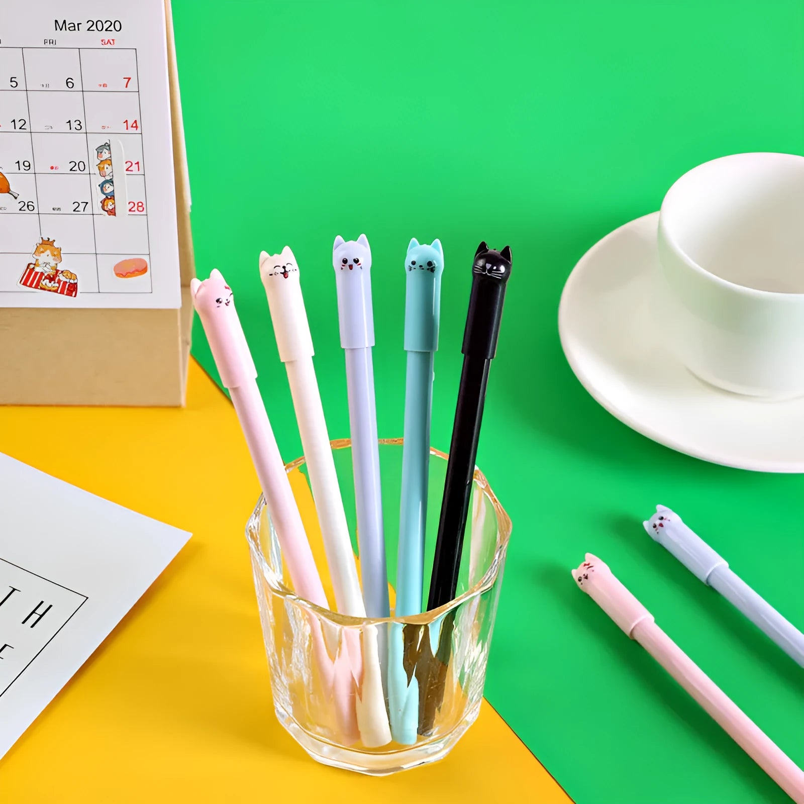 Cute pendulum cat gel pen with swinging charm, 0.5mm tip, shown in multiple ink colours.