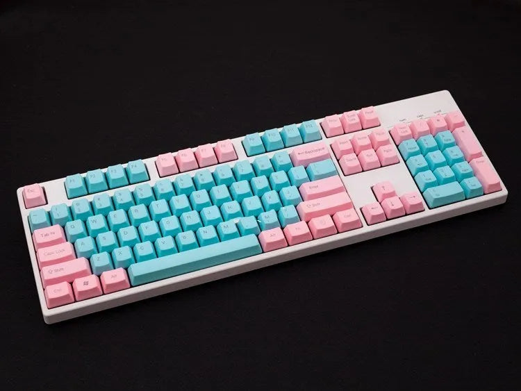 Set of opaque pink PBT keycaps with side-printed legends for a mechanical keyboard.