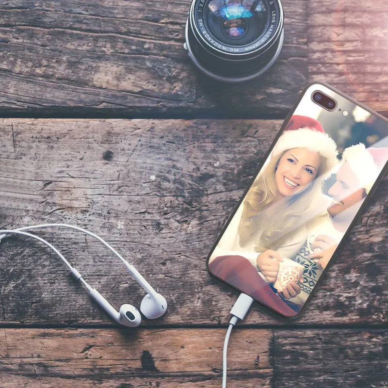 Patterned ultra-thin iPhone case with raised edges protecting the screen and camera lens.