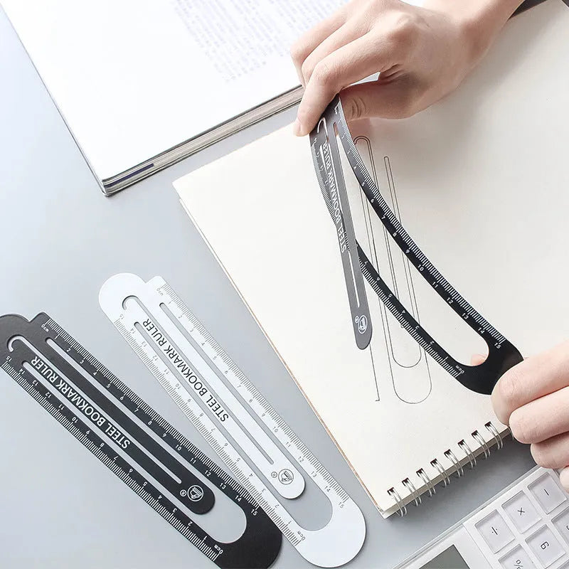 Black and white two-sided metal ruler showing 12 cm manganese steel construction
