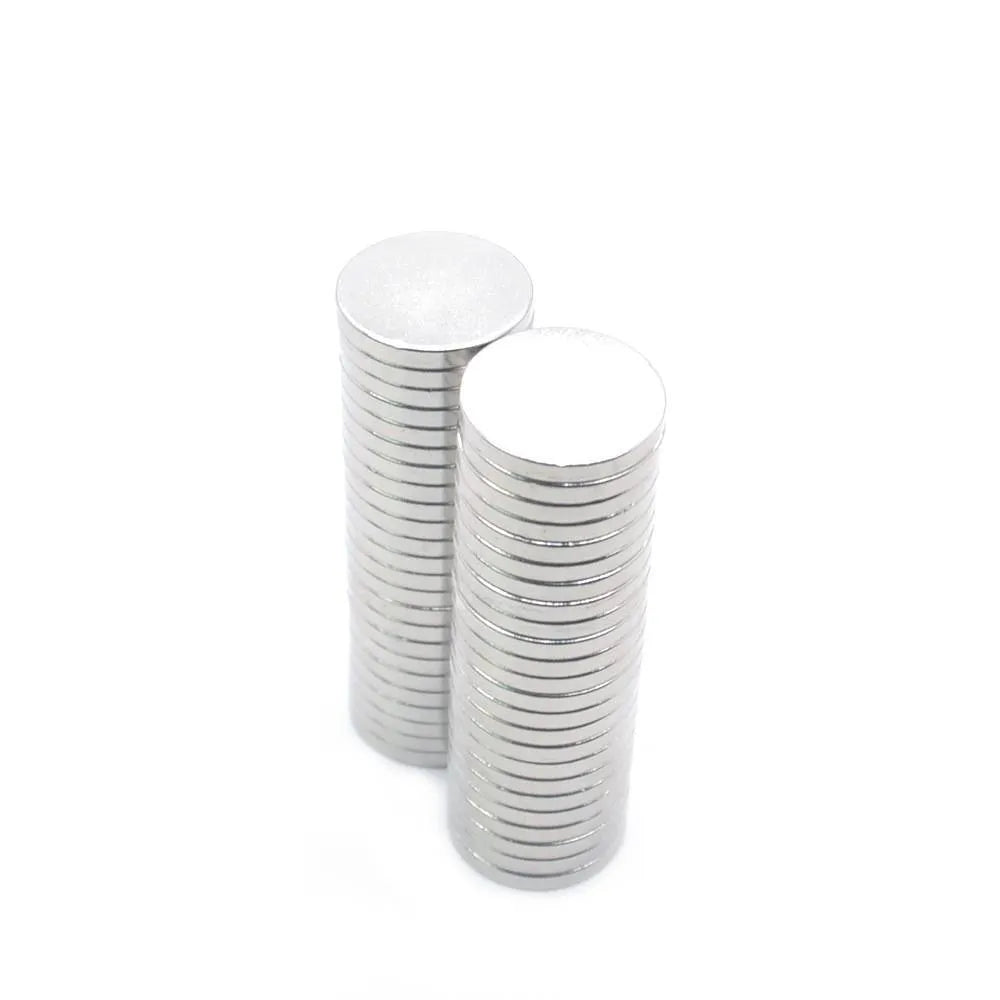 Rare earth NdFeB magnet disc 14x2mm silver N35 grade on white background