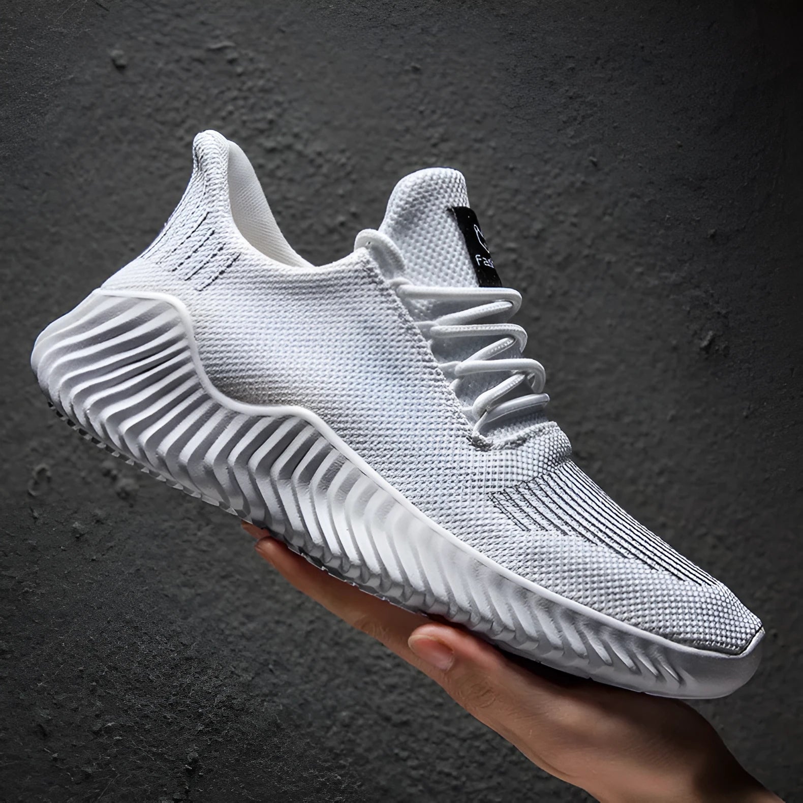 Men's breathable ultra-light running shoes with white upper and grey sole, side view
