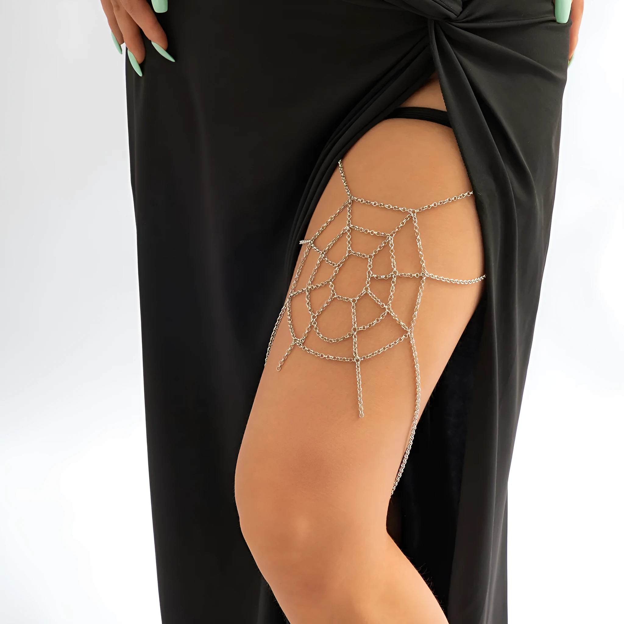 Women's geometric body chain in silver, made from alloy with electroplated finish, shown as an anklet