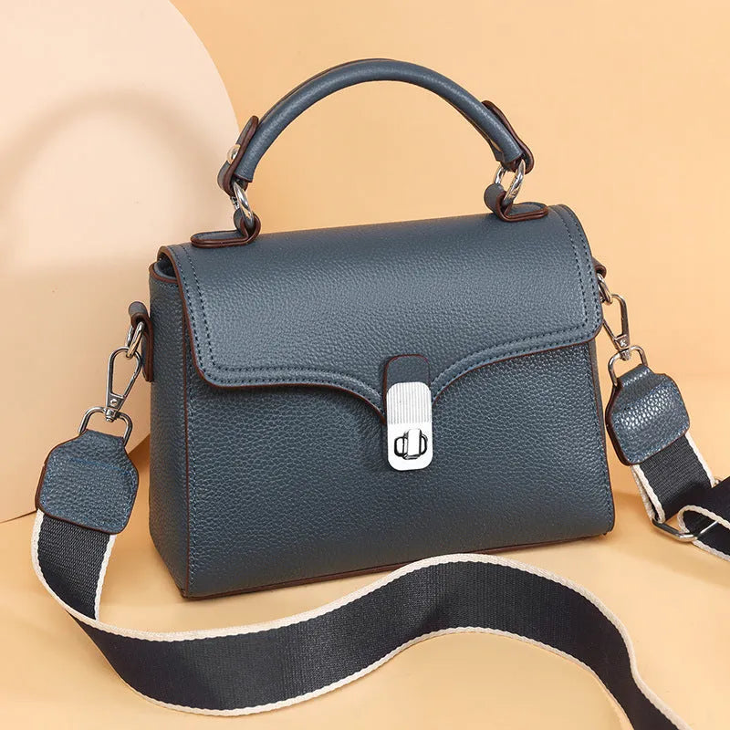 Genuine leather oval cross-body bag 21x18x9cm with sandwich pocket, shown in white, black, khaki and blue