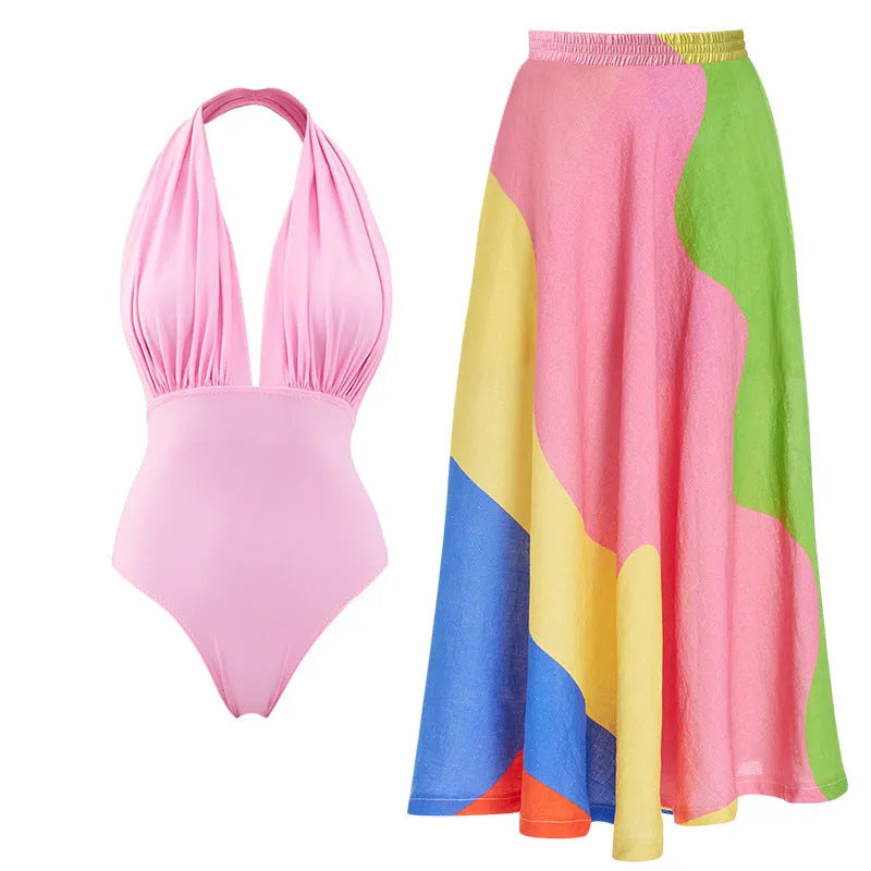 Women's solid colour one-piece swimsuit with deep V halter neck and backless design.