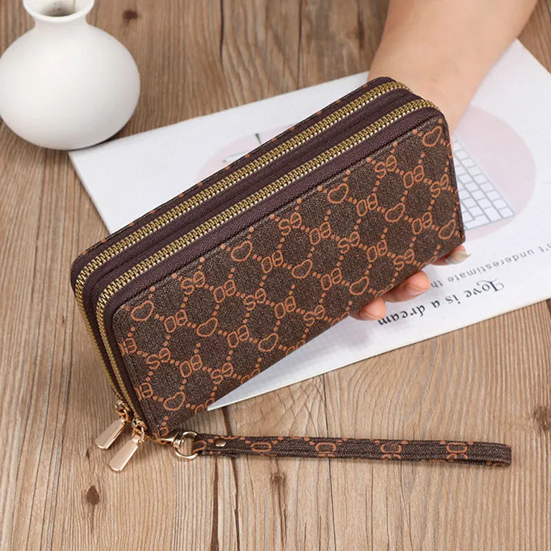 Long PU leather wallet clutch with zip closure and retro print decoration showing internal compartments