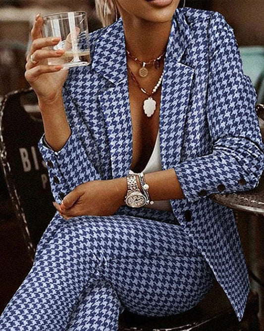 A stylish women's plaid suit set with a tailored blazer and slim-fit pants in black and white or blue colors.