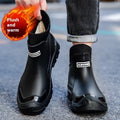 Pair of large size fixed velvet PVC rain boots in black, with round toe and flat heel, for outdoor use