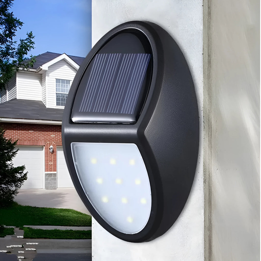 Black compact square solar-powered LED wall light for outdoor use.