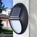 Black compact square solar-powered LED wall light for outdoor use.