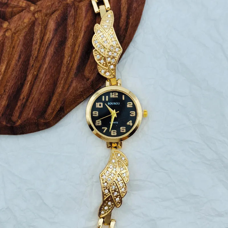 Women's stainless steel watch with a round dial shown in gold, golden white, and black/gold surface options.
